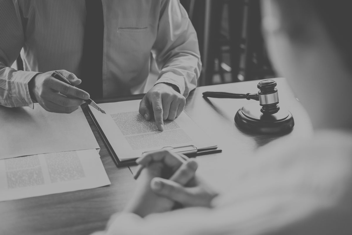 Legal professionals reviewing a document